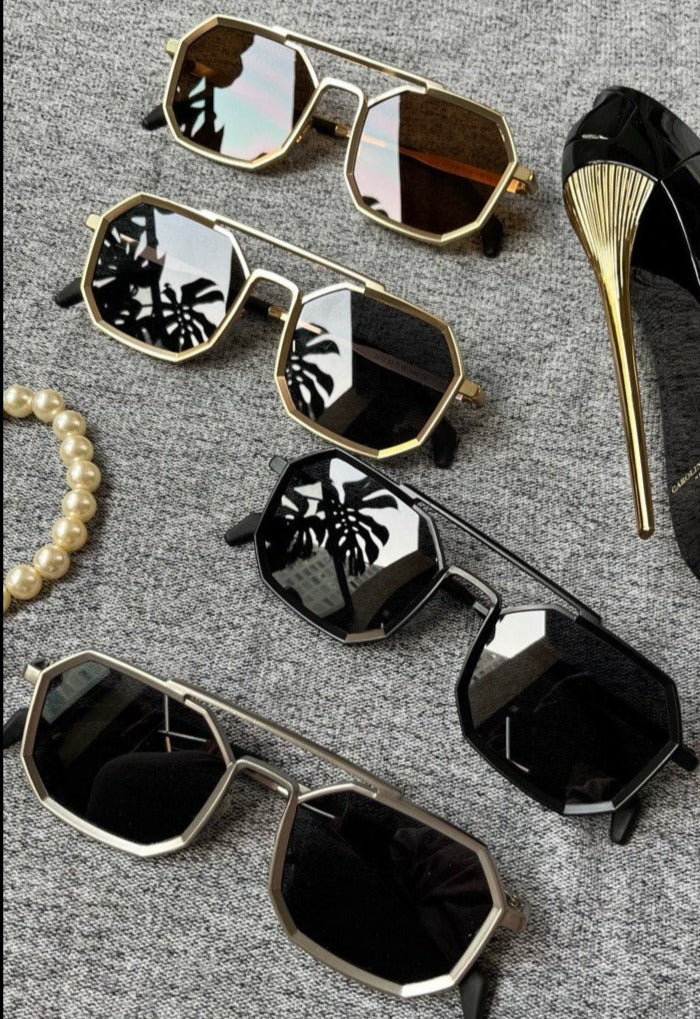Cool and Hip Octagonal metal sunglasses that fits elegantly on your face and adds a bit of style to your look. Unisex Sunglasses UV400 protection against harmful rays UA A/U Material: Brass and Resin Suitable for Prescription Lenses Dimensions: Lens Width: 55mm, Lens Height: 42mm, Nose Bridge: 20mm, Temple Length: 150mm, Frame Width: 145mm